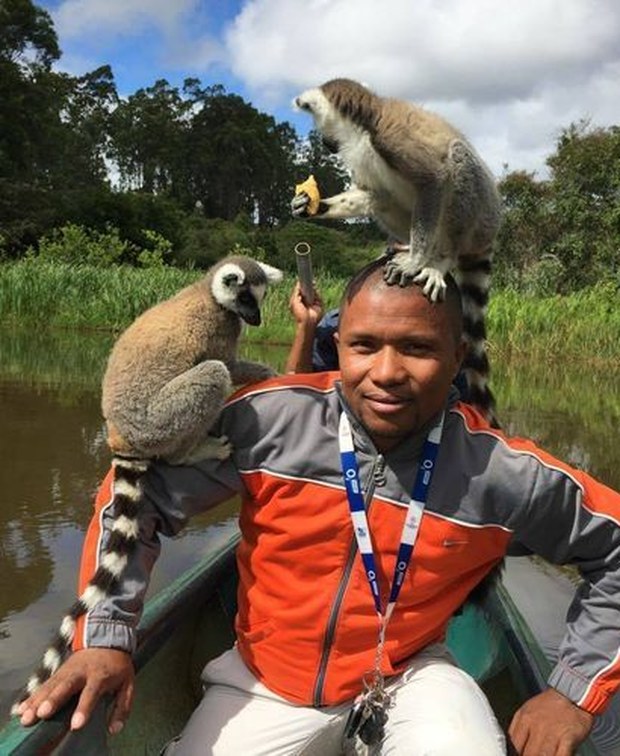 Mamy, founder and head driver-guide of Sun Tours Madagascar, with ring-tailed lemurs